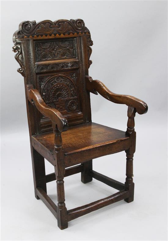 An early 18th century style Welsh oak joined armchair, W.2ft H.3ft 10in.